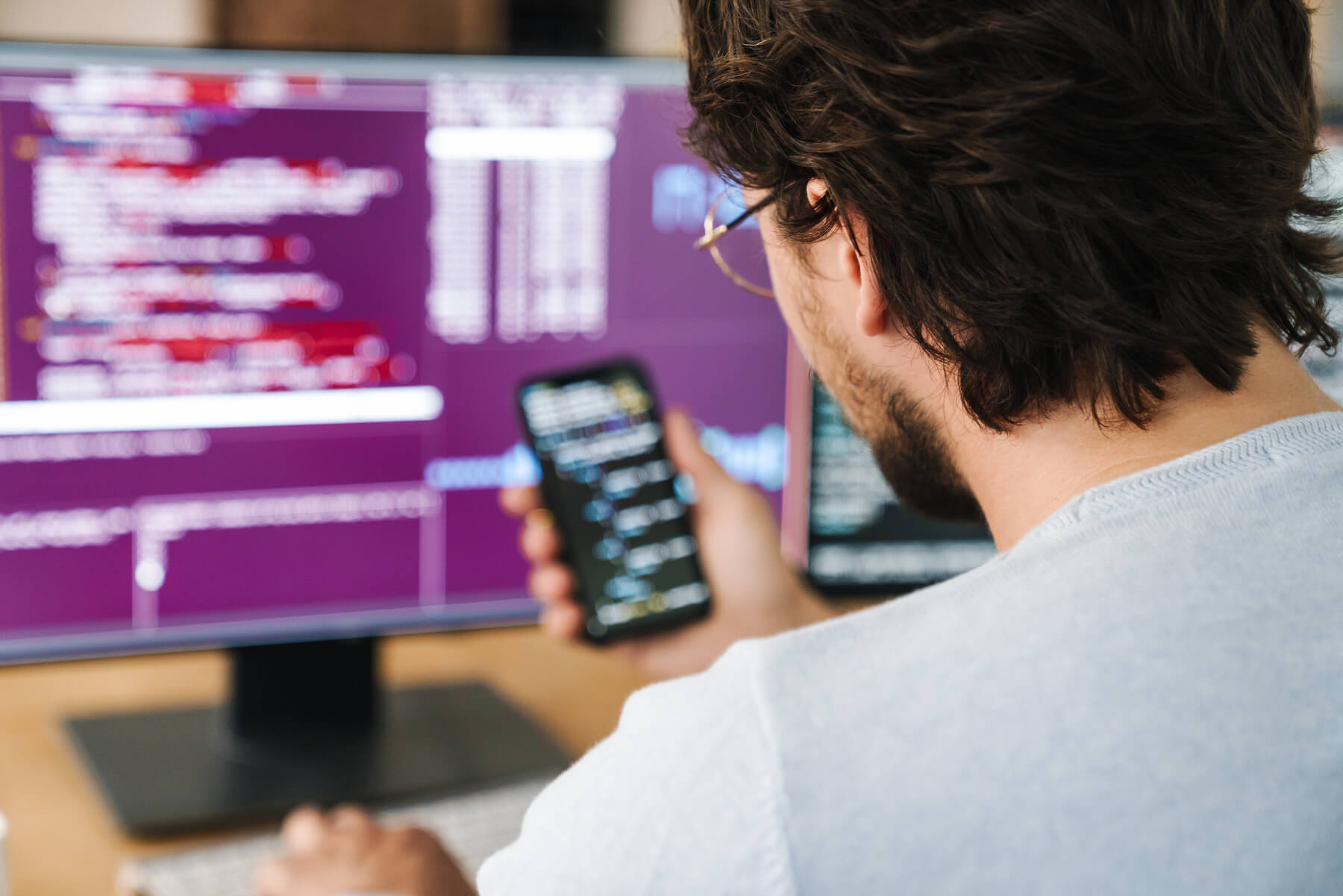 image of programmer man using smartphone while wor 2023 11 27 04 50 20 utc.jpg